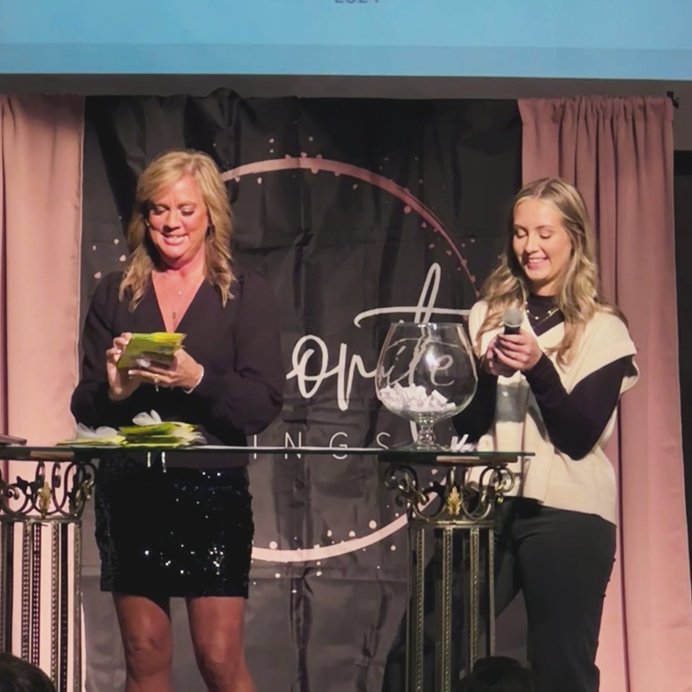 Danielle and Sadie drawing door prizes