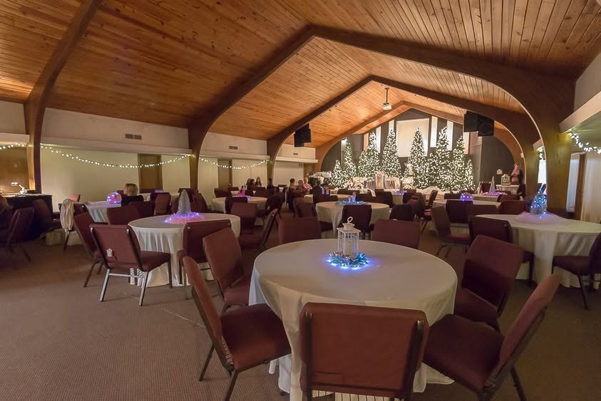 The room set with tables and Christmas trees